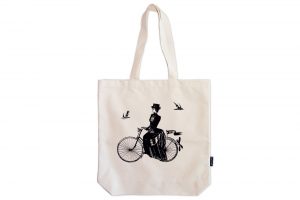 a-lady-rides-bicycle-tote-bag